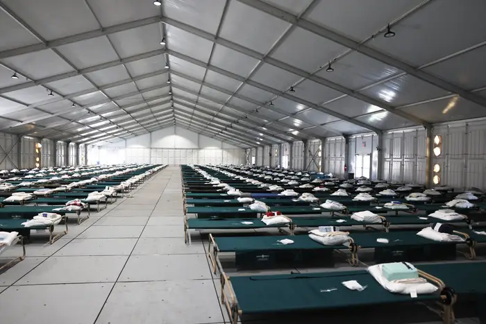 Beds are seen in the dormitory during a tour of the Randall's Island "Humanitarian Emergency Response and Relief Center". The city estimates it will cost $1 billion in response to the migrant crisis.